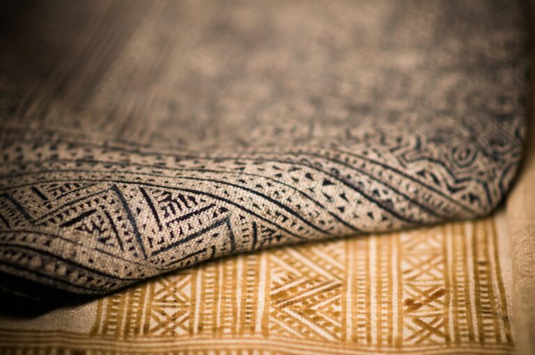 A close up that shows the texture of two different patterned rugs